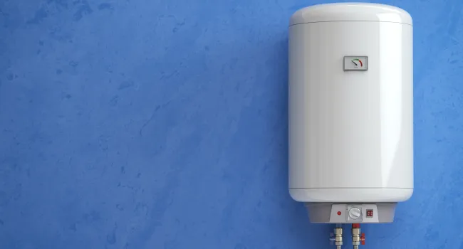 Modern white water heater tank mounted on a blue textured wall with control knobs and pipes below.
