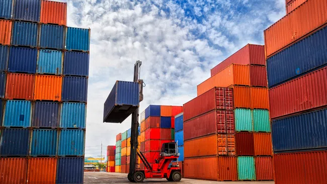 a truck carrying containers