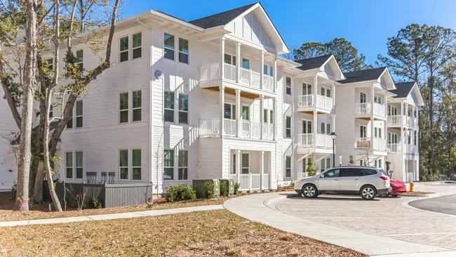 a white building with a parking lot