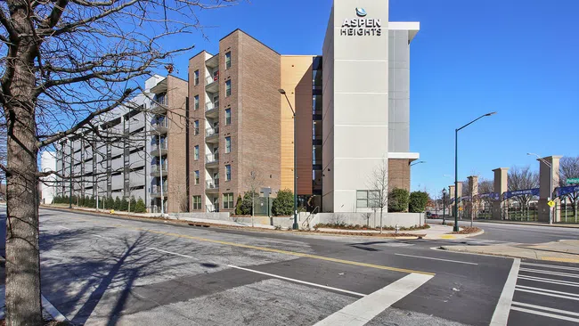 a large building with a parking lot