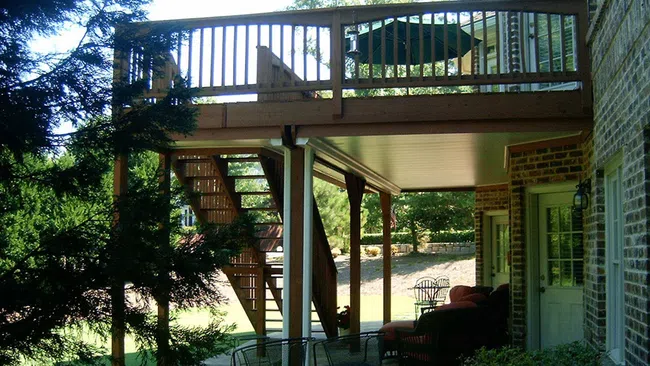 a deck with a deck and chairs