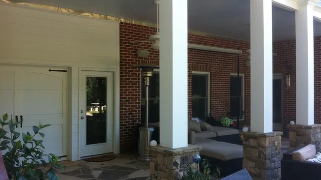 a house with a patio and a brick patio