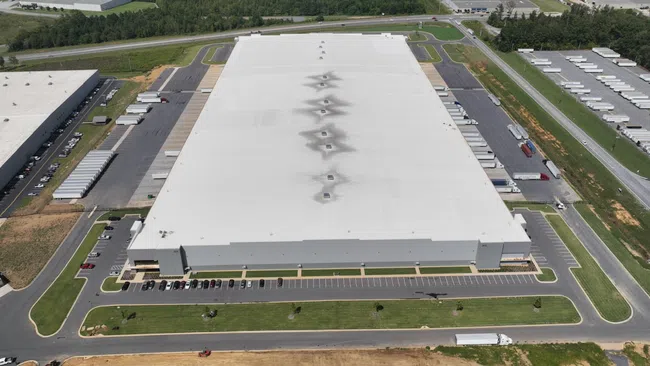 a large building with a parking lot