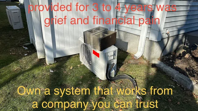Outdoor air conditioning unit with cinder blocks on top near a house and promotional text about system reliability.
