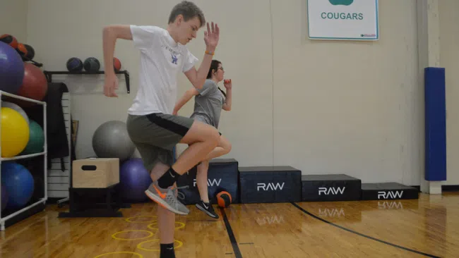 a man and a woman exercising