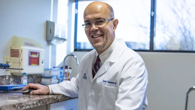 a doctor smiling at the camera