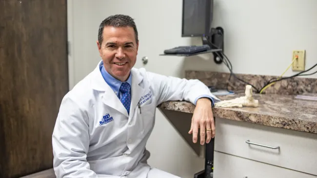 a doctor smiling at the camera