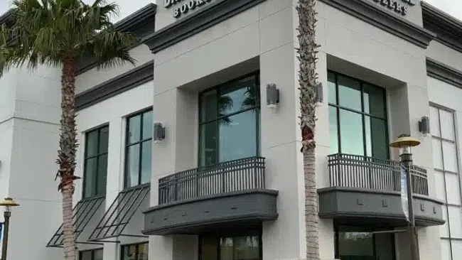 Side-by-side images of Barnes & Noble bookstore buildings with palm trees on urban street corners.