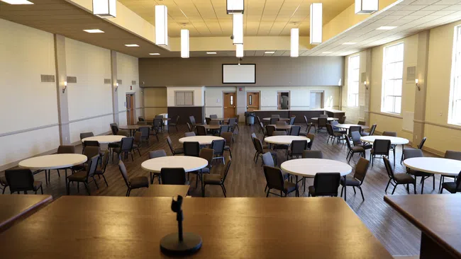 a room with tables and chairs