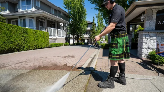 a man holding a hose