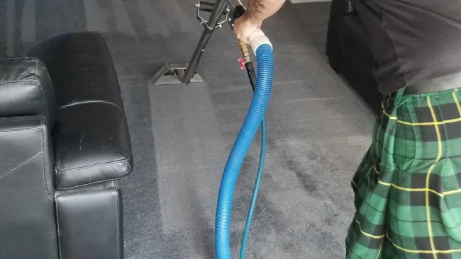 a person cleaning carpet