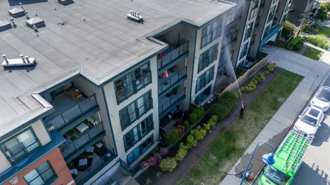 a high angle view of a building and a person washing a building