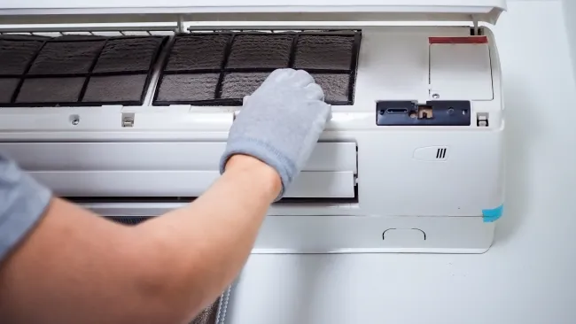 a person holding a white machine