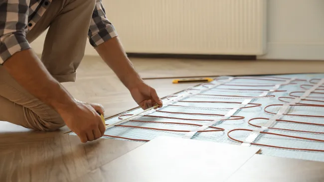a person drawing on a paper