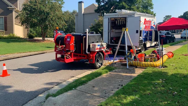 a red truck parked on the side of a road