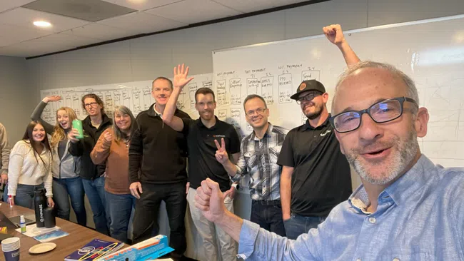 a group of people standing in a room