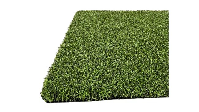 Close-up of a square piece of dense green artificial turf on a white background.