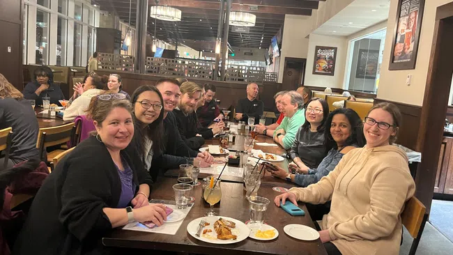 Sharon Zinger et al. sitting at a table