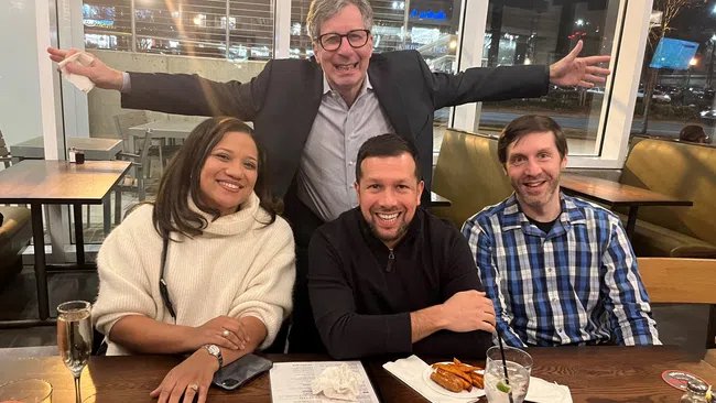 a group of people sitting at a table