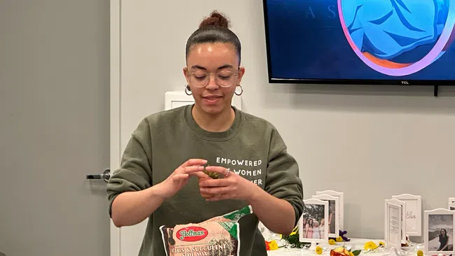 a person holding a bag of food