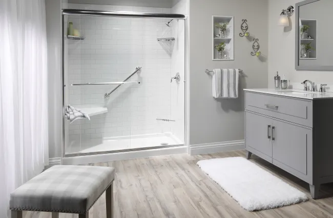 a bathroom with a tub and a bench