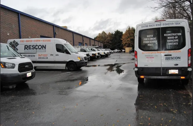 a group of cars parked in a parking lot