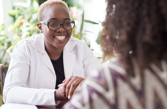 a doctor smiling at a patient