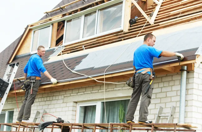 men working on a roof