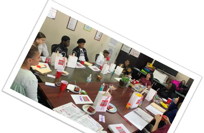 a group of people working at a table