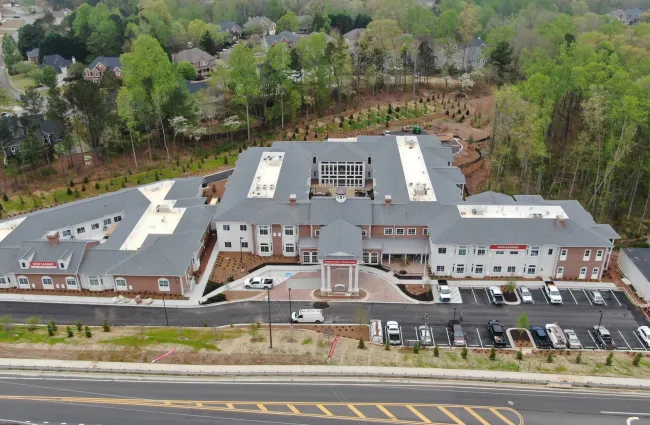 a large building with a parking lot