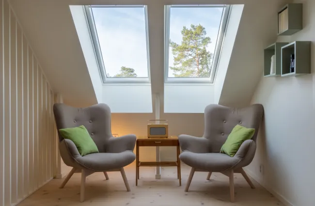 a room with chairs and a table