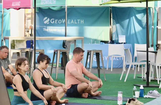 a group of people sitting under a tent