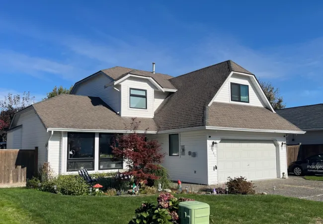 a house with a yard and a fence