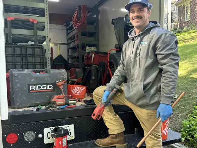 a man holding a shovel
