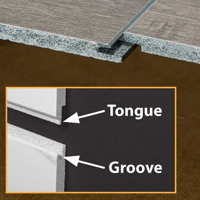Close-up of tongue and groove wood panels showcasing the interlocking joint design for flooring or paneling.