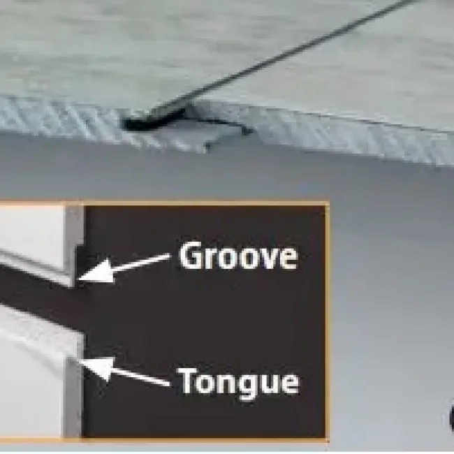 Close-up of tongue and groove joint in wooden boards illustrating interlocking edges for secure fitting.