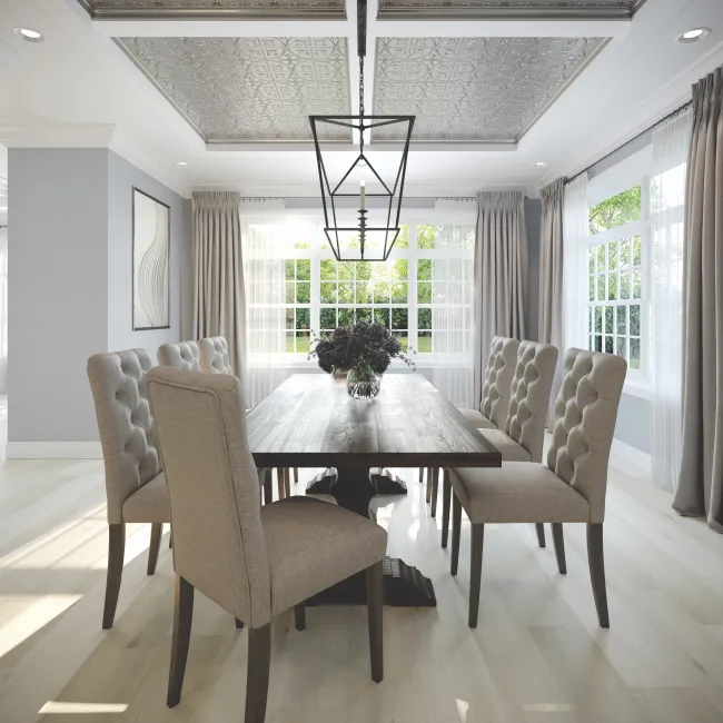 Bright dining room with tufted beige chairs, wooden table, decorative ceiling, and large windows with curtains.