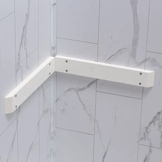White corner shower grab bar mounted on marble-look tiled walls with metal screws