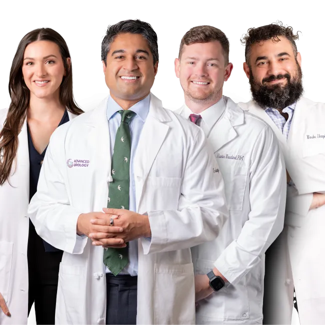 Group of four diverse medical professionals smiling confidently wearing white lab coats