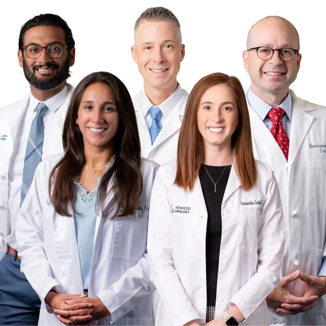 Group of five diverse medical professionals wearing white lab coats smiling against a white background