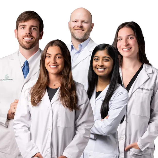Group of five diverse medical professionals smiling and wearing white lab coats against a white background
