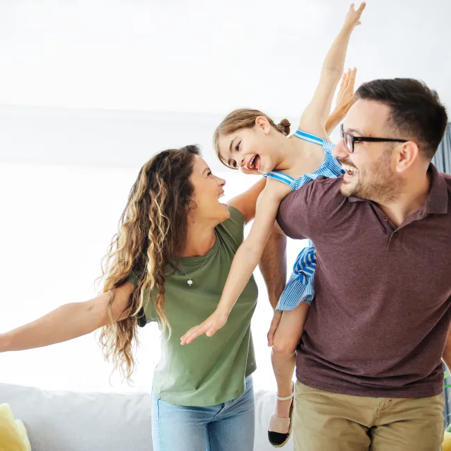 a family playing in a house