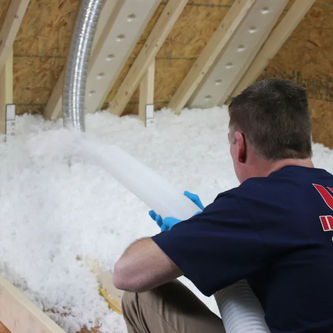 a man sitting in an attic