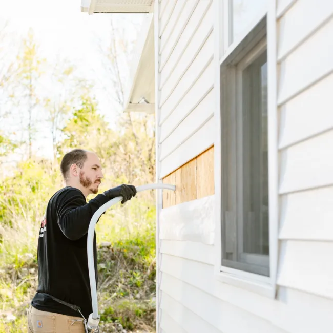 a person holding a hose