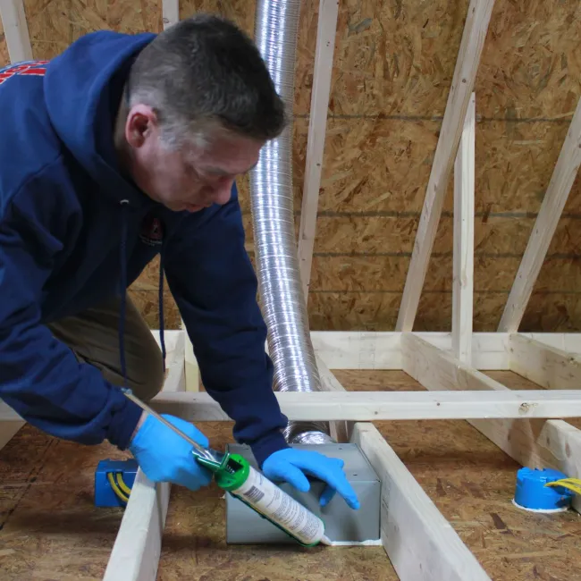 a man working in an attic