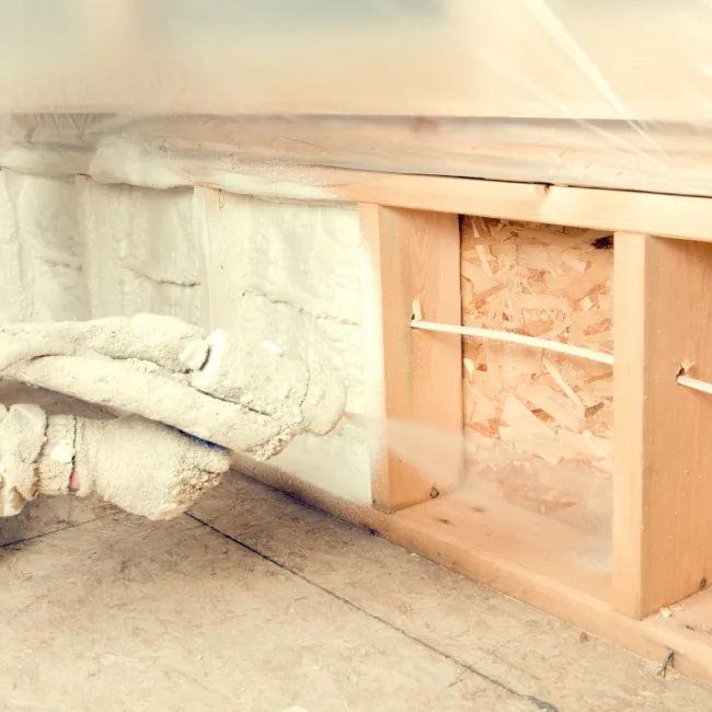 a wooden cabinet with a white sheet