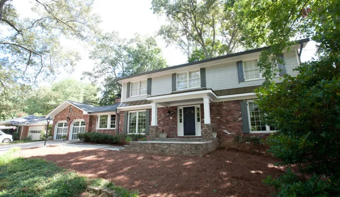 a white house with a driveway