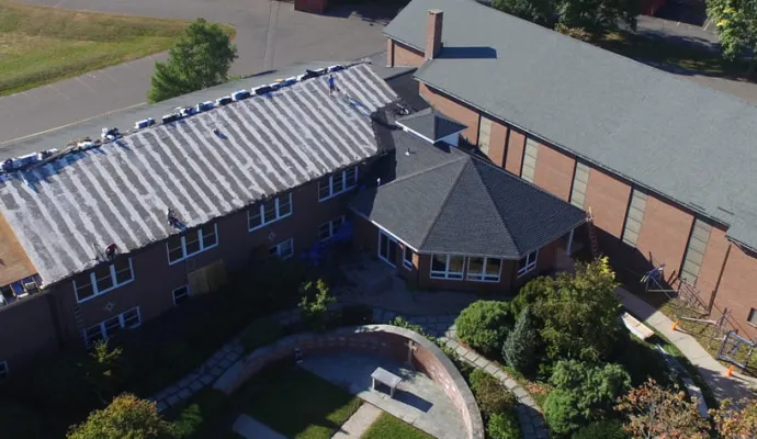 commercial building with roof replacement in progress