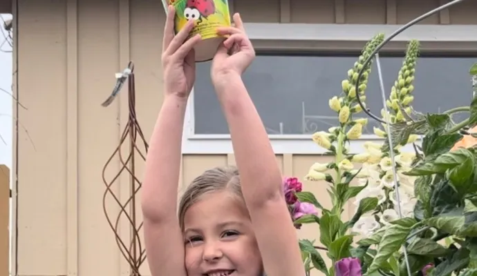 a child holding a toy