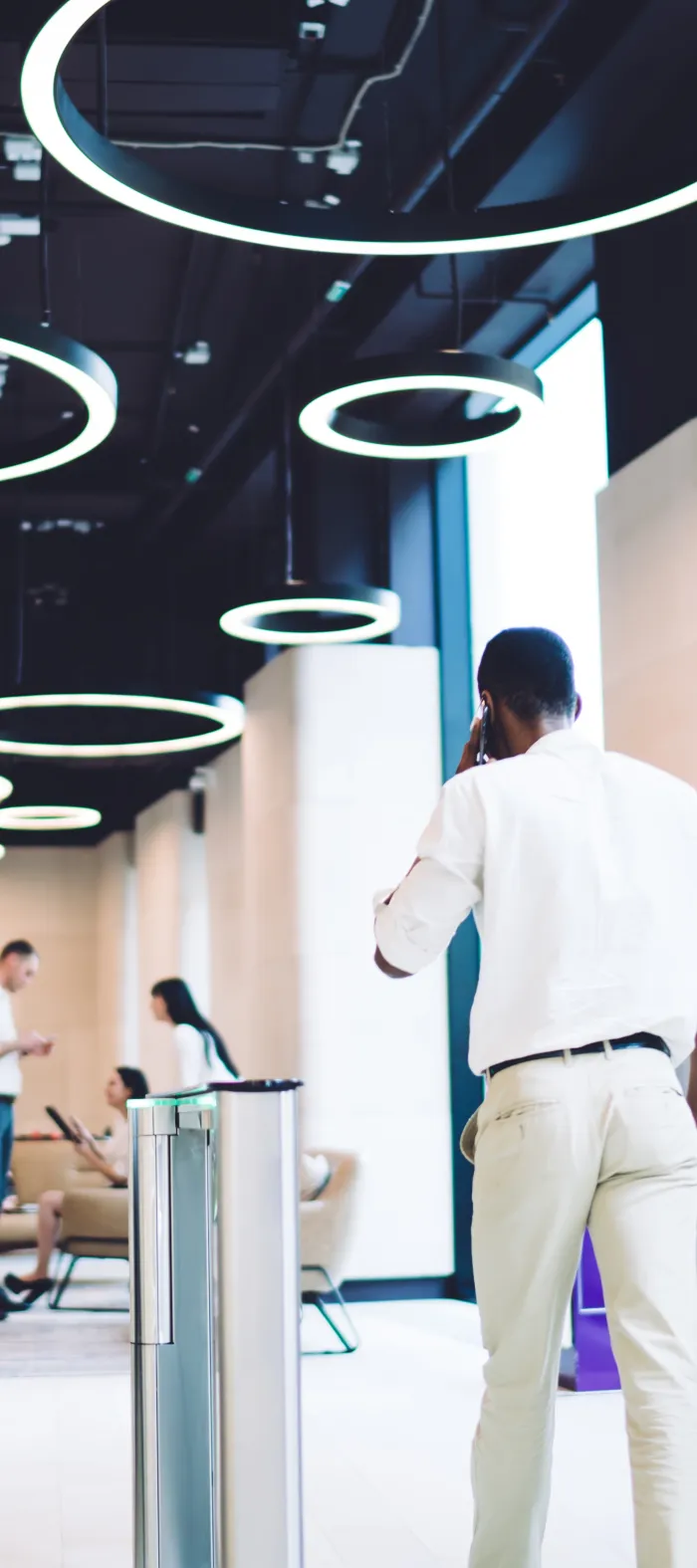 a woman and a man walking down a hallway